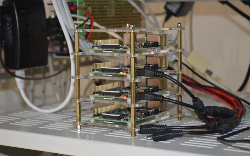 Stacked Raspberry Pi boards, with common power supply