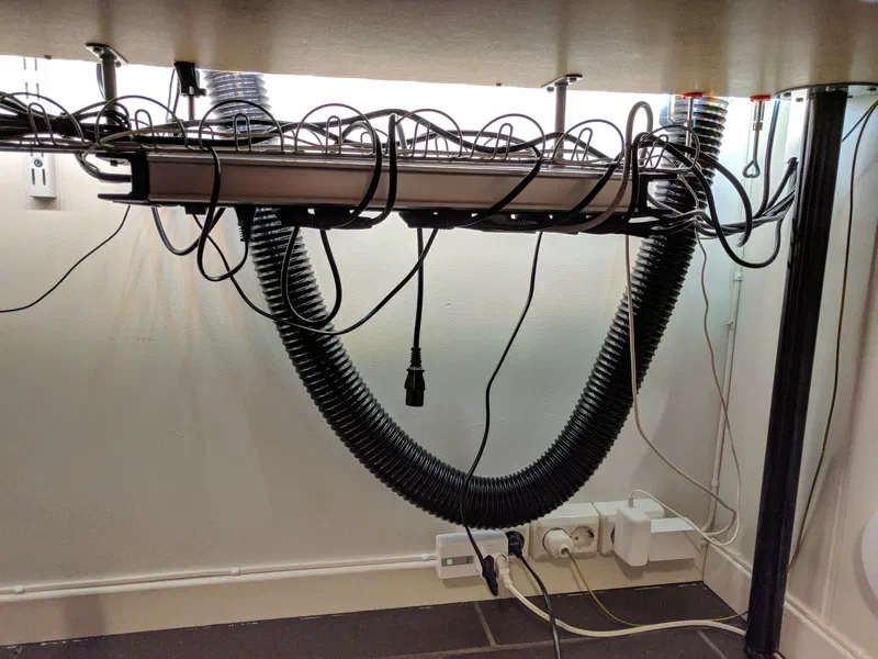 Flexible hose and power distribution, under desk